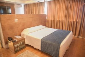 Postel nebo postele na pokoji v ubytování Itaimbé Palace Hotel + 30 fotografií