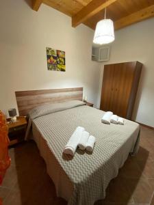 Кровать или кровати в номере Casa vacanza Mare blu Sibiliana