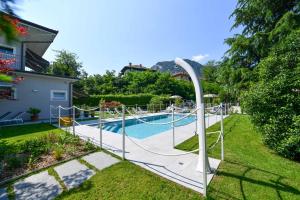 a pool with a slide in a yard at Regina e Oriente in Baveno +76 photos