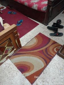 a rug on the floor in a living room at سوهاج الجديدة 