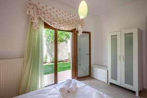 Postel nebo postele na pokoji v ubytování Casa Bianca Sea View
