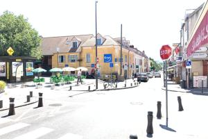 a rendering of a street with a stop sign at M4 Coeur Massy RER BC 600m - Orly20 min in Massy