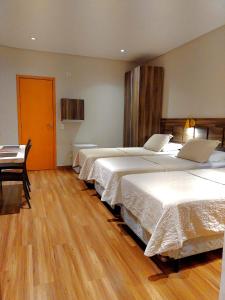 Postel nebo postele na pokoji v ubytování Guess Hotel & Motel