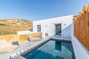 a villa with a swimming pool on a balcony at XEROLITHIA I in Agios Sostis
