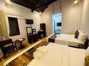 Postel nebo postele na pokoji v ubytování The Poplar Resort Phú Quốc