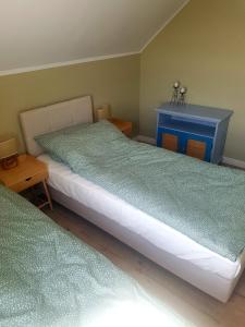 Postel nebo postele na pokoji v ubytování Apartament - Przy Łące
