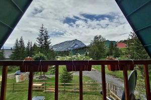 a view of a mountain from a porch at Durmitor Chill Chalet in Žabljak