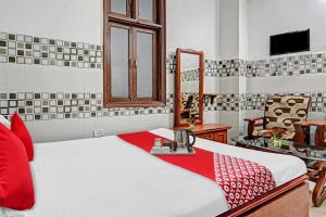 Katil atau katil-katil dalam bilik di OYO Flagship Hotel Evergreen Residency