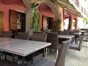 a row of tables and chairs in a restaurant at Albergo Ristorante La Rocca in Firenzuola