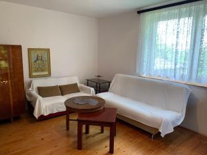 Postel nebo postele na pokoji v ubytování DOMEK NA LATYFUNDIACH