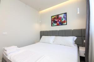 Postel nebo postele na pokoji v ubytování N HOTEL CITY CENTER BY NOSHI