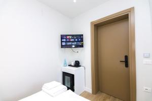TV a/nebo společenská místnost v ubytování N HOTEL CITY CENTER BY NOSHI