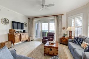 a living room with a couch and a tv at Ocean Place Condo in Amelia Island