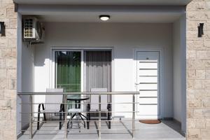 a balcony with a table and chairs on it at Apartments Ali in Ulcinj