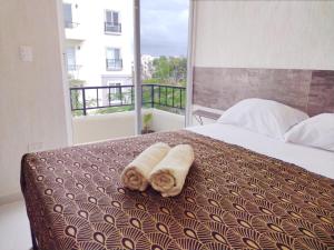 Ένα ή περισσότερα κρεβάτια σε δωμάτιο στο Love Vacations Tulum +56 φωτογραφίες