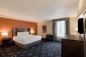a hotel room with a bed and a window at Grand Z Hotel Casino by Red Lion Hotels in Central City