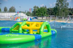 a water slide in a pool in a water park at Studio Syreny in Warsaw