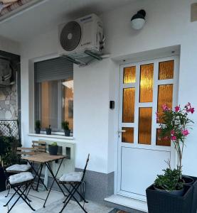 a patio with a table and chairs and a door at Apartment Ante in Split