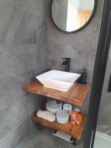 a bathroom with a sink and a mirror at Converted Barn in Bath in Bath +16 photos