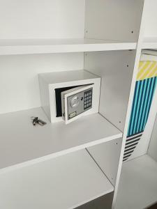 a small microwave on a shelf in a room at Stay in Palermo in Buenos Aires