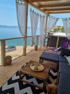 a living room with a view of the ocean at La Vista in Drage