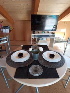 A television and/or entertainment centre at AB Preveza Apartments -15 Meters Over the Sea