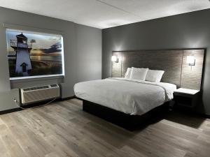 Postel nebo postele na pokoji v ubytování Days Inn & Suites by Wyndham Summerside