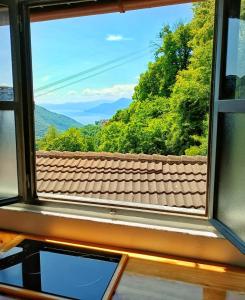 a window view of a mountain view from a train at Ca' di Aroha in Musignano