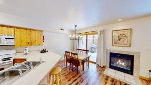 a kitchen and dining room with a fireplace at The Rock #3461 in Moab