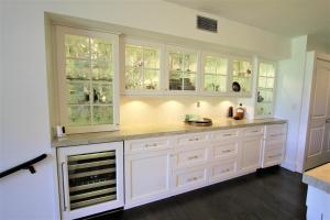 a kitchen with white cabinets and a counter top at Kaanapali Royal Golf Retreat in Lahaina