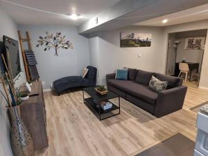 a living room with a couch and a table at 2 bedroom* Minutes from downtown *Firepit in Colorado Springs
