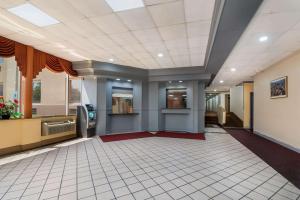 a large room with a tile floor and a ceiling at Rodeway Inn in Philadelphia