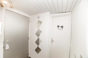 a bathroom with a shower and a door at City centre hidden gem! Apartment for up to 3 people in Brussels