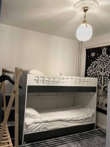 a room with two bunk beds and a chandelier at Hostel Taksim in Istanbul