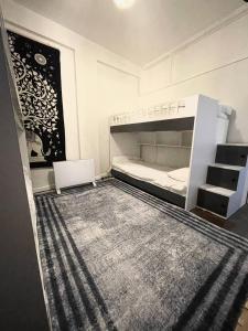 a bedroom with a bunk bed with a laptop in it at Hostel Taksim in Istanbul