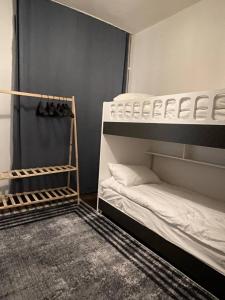 two bunk beds in a room with shoes on the floor at Hostel Taksim in Istanbul