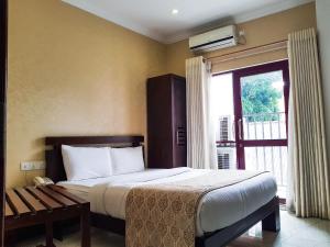 Postel nebo postele na pokoji v ubytování Galaxy City Hotel + 37 fotografií