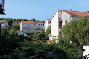 a view of a city with houses and trees at Triple Room Supetar 5658b in Supetar +11 photos