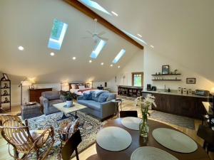 a living room with a couch and a table at Madrona Suite in Eastsound