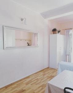 a white room with a mirror on the wall at Apartments with parking space Zaboric, Sibenik - 21367 in Zaboric