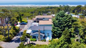 an aerial view of a house with the ocean in the background at Sandpiper Shores in Florence