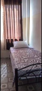 Ein Bett oder Betten in einem Zimmer der Unterkunft Jawal Hotel