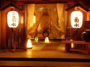 a room with two lanterns and a bench in front at 旬樹庵　菊水 in Chikuma