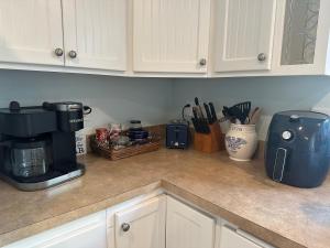 a kitchen counter with a coffee maker and a coffee pot at Sandpiper Shores in Florence