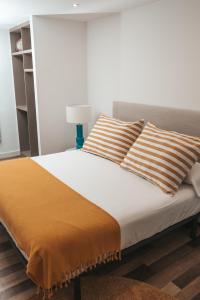 A bed or beds in a room at ACASADETEO