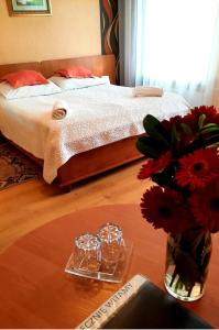 Postel nebo postele na pokoji v ubytování Hotel Bursztyn