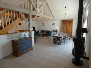 a living room with a table and a dining room at Maison rénovée, 8 pers, animaux admis, jardin - FR-1-540-188 in Notre-Dame-de-Monts