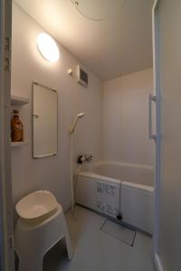 a bathroom with a toilet and a bath tub at Cominka - Vacation STAY 30137v in Chino