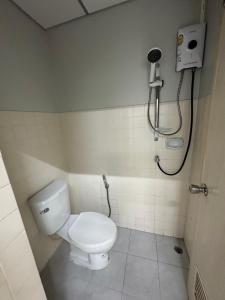 a bathroom with a toilet and a shower at 辉煌 Icon 民宿 in Bangkok