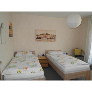 a room with two beds in a room at Haus am See in Horn-Bad Meinberg